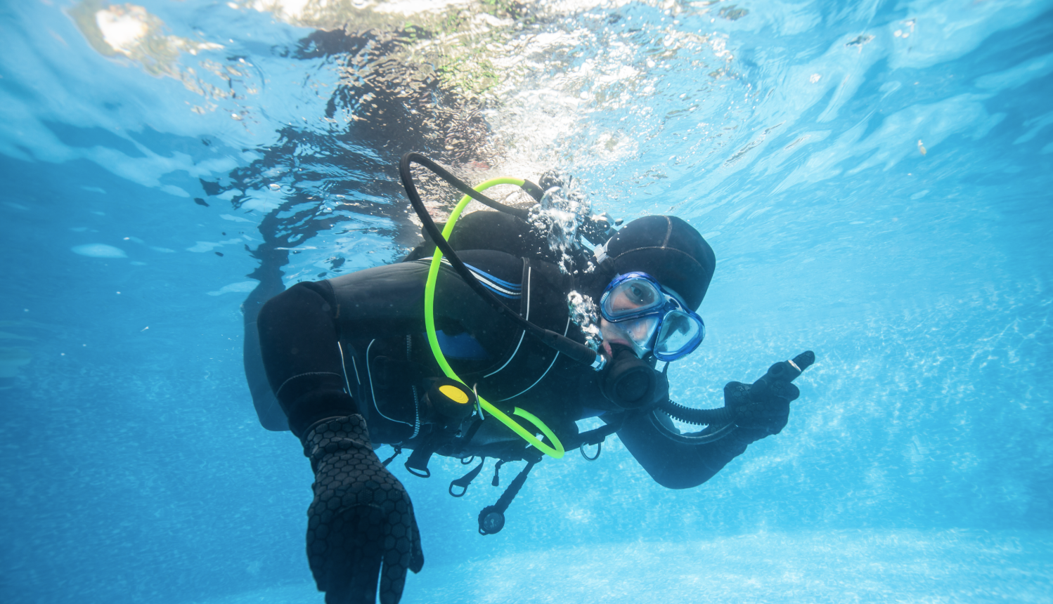 Professional pool scrub cleaning in progress